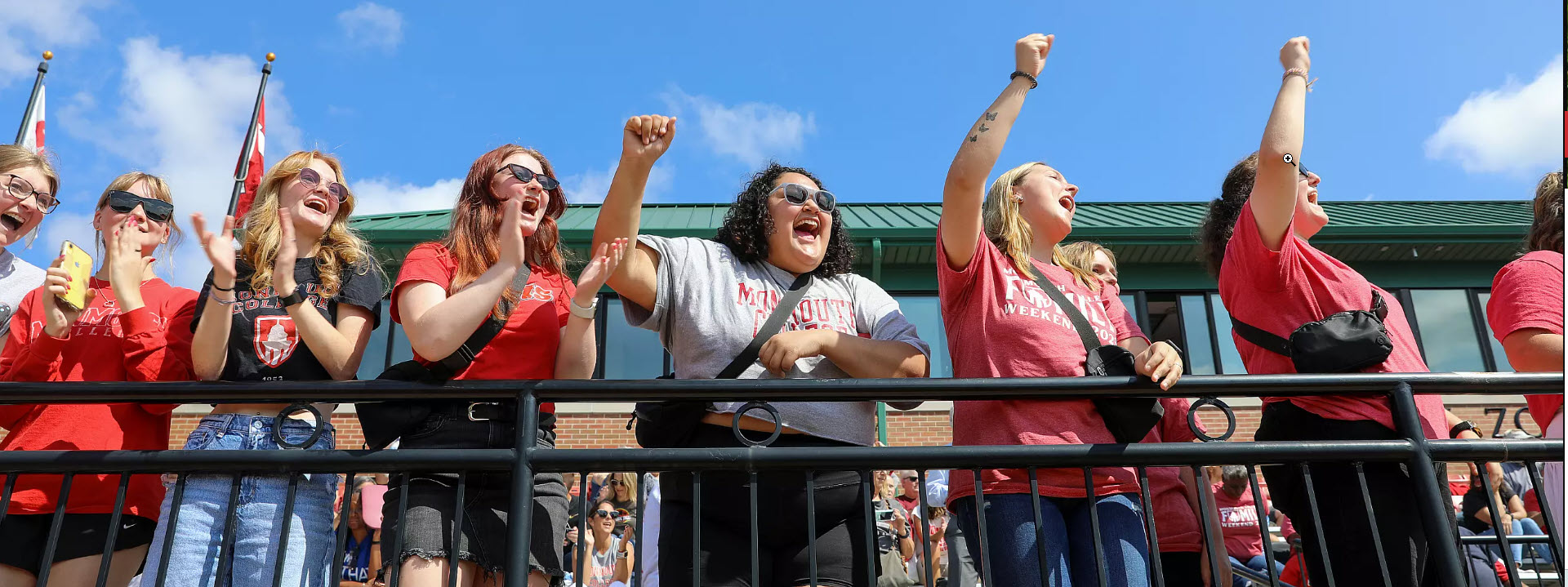 Students cheering at Monmouth athletic event